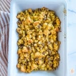 Cornbread dressing in a white baking dish.