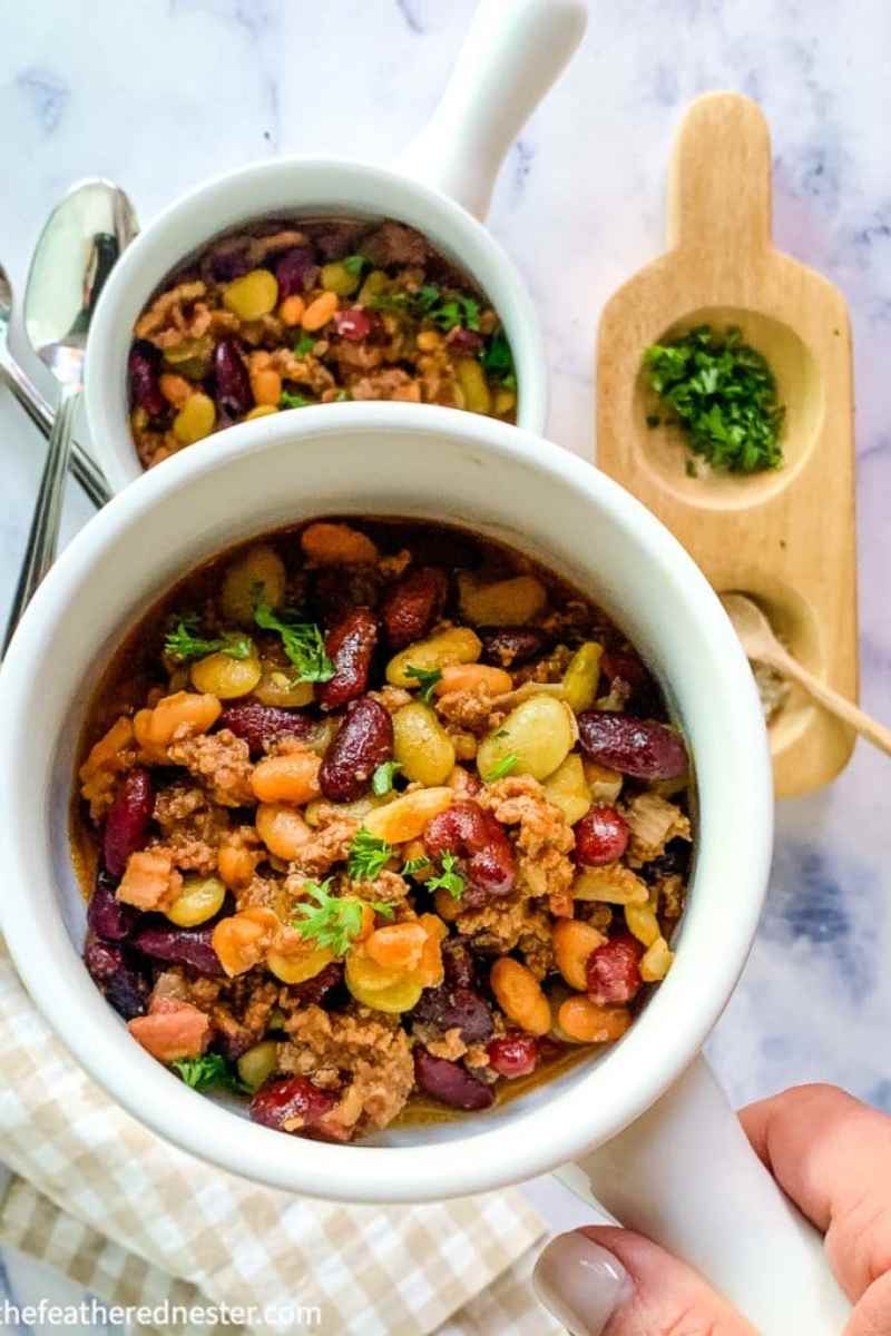 Dish of baked beans with ground beef.