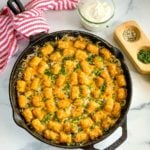 a skillet of chicken tater tot casserole.