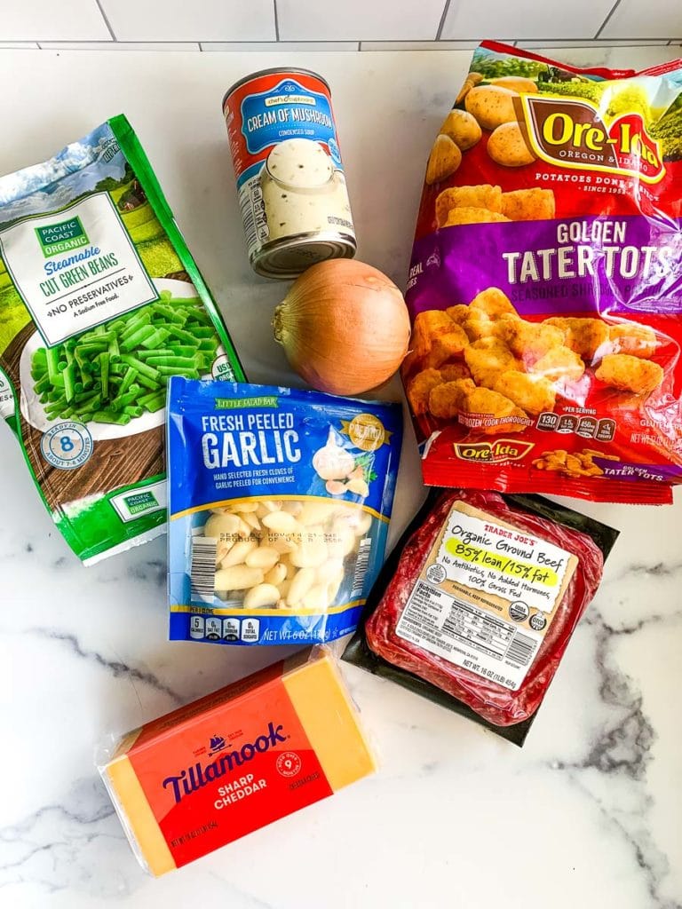 tater tots, cream of mushroom soup, frozen green beans, garlic, cheddar cheese, onion, and ground beef for a casserole recipe