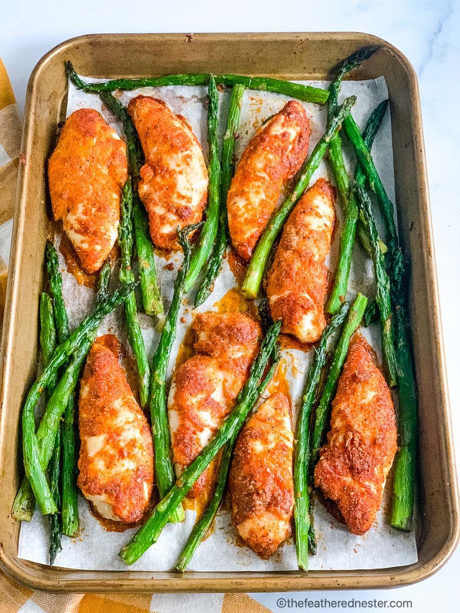 a sheet pan dinner of chicken and asparagus.