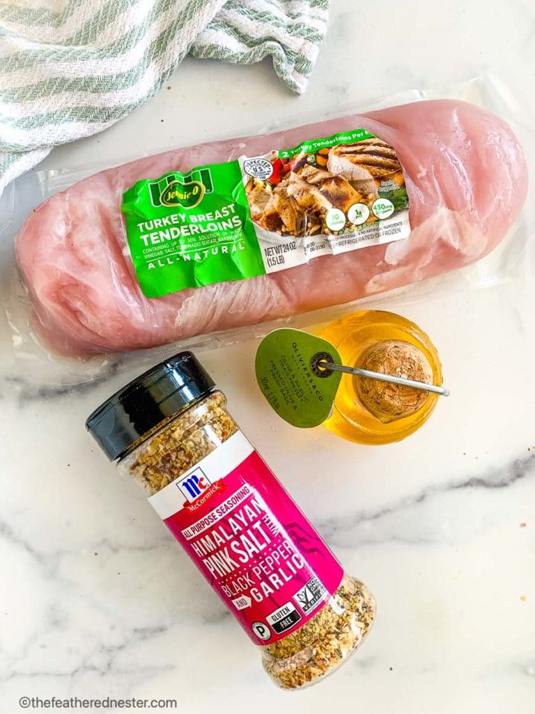 A package of boneless skinless poultry, chicken broth, and marinade ingredients for a turkey tenderloin recipe.