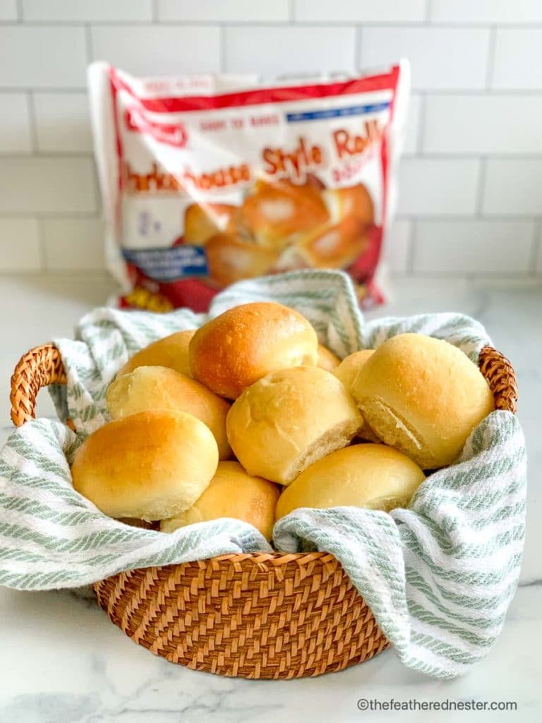 a bag of Bridgford Parkerhouse Rolls and a basket of fresh yeast rolls from frozen dough.