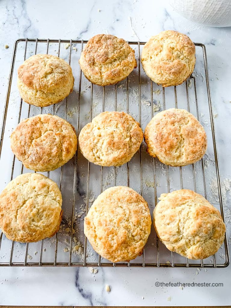 freshly baked buttermilk biscuits cooling on a cooling rack