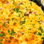 a pot of hashbrown casserole with ham