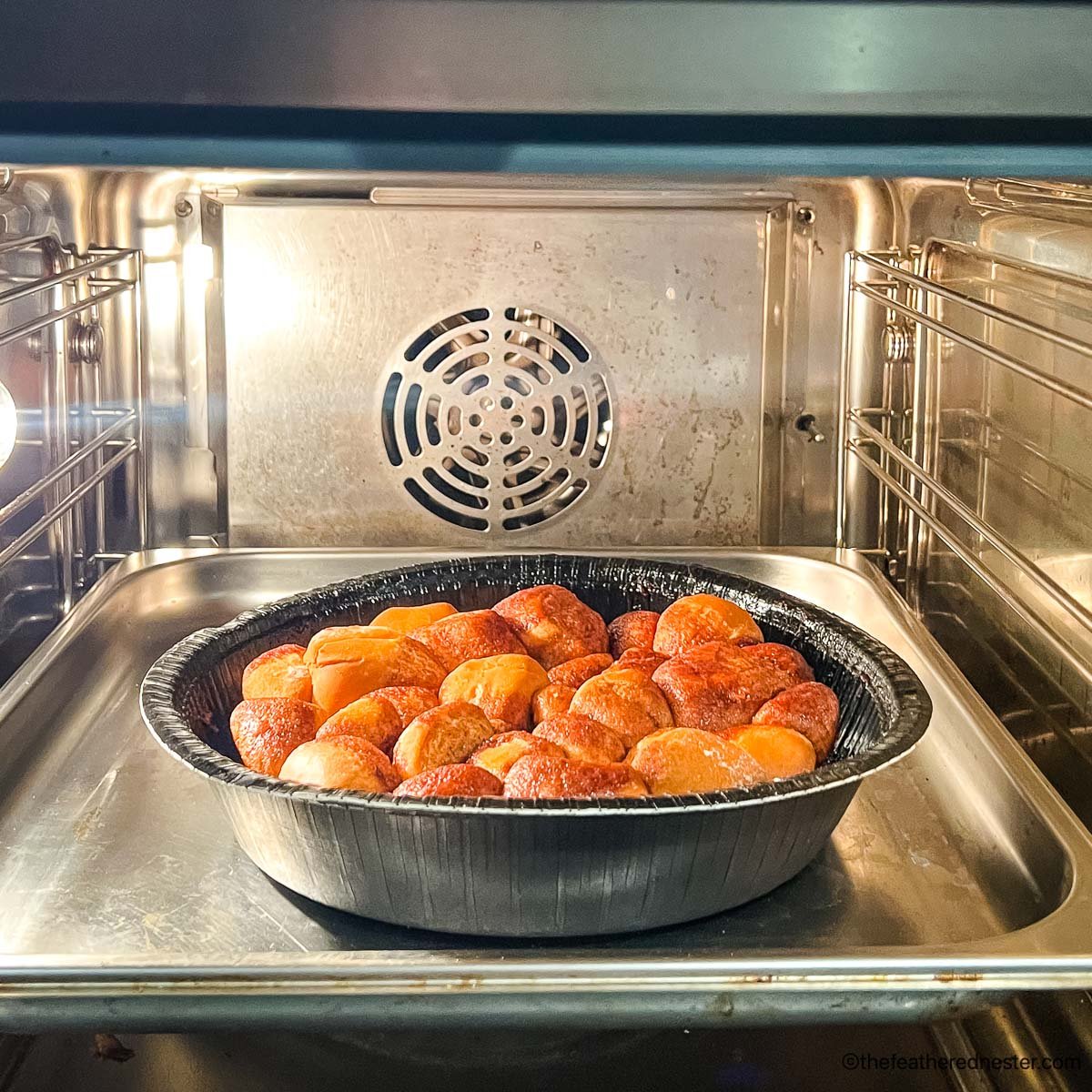 a container of monkey bread in the air fryer.