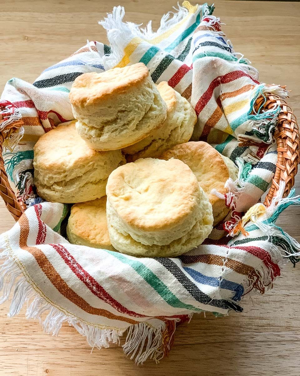 a basket full of self rising flour buttermilk biscuits.