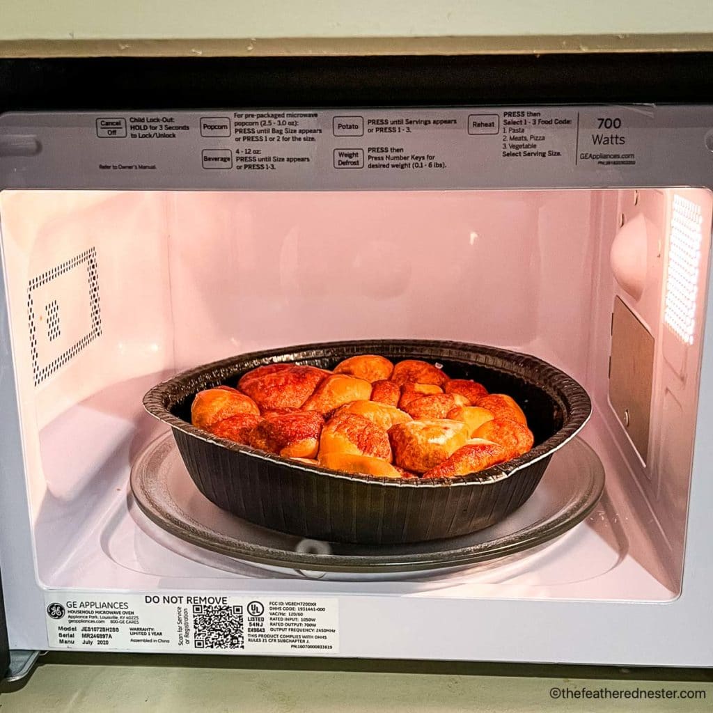 a container of monkey bread in the microwave