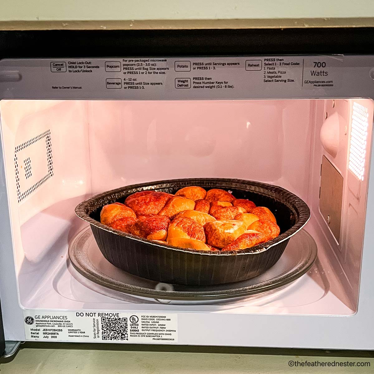 a container of monkey bread in the microwave.