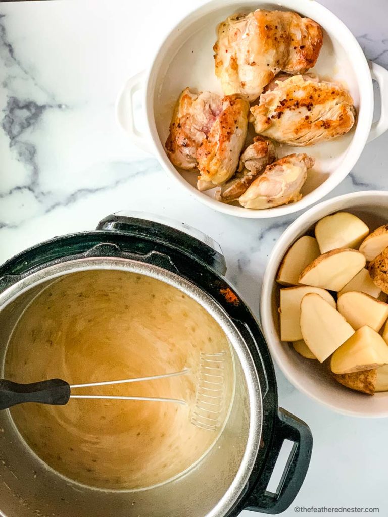 preparing chicken thighs and potatoes in the pressure cooker