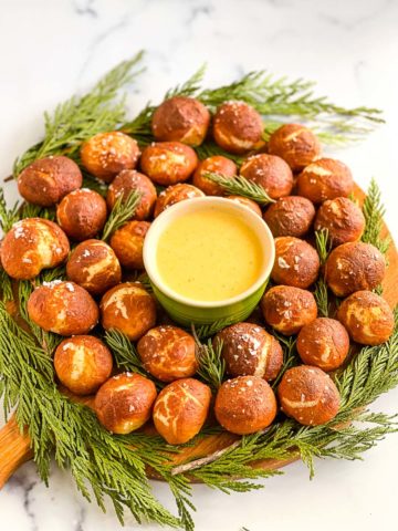 a circle of soft pretzel bites with cheese