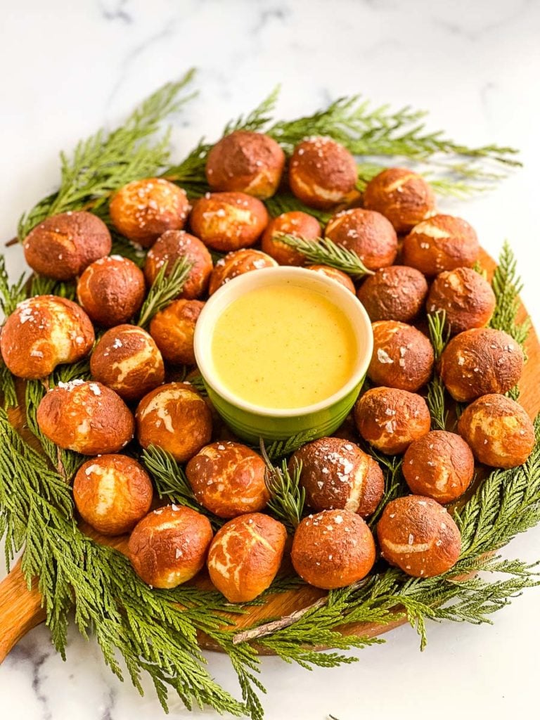 a circle of soft pretzel bites with cheese.