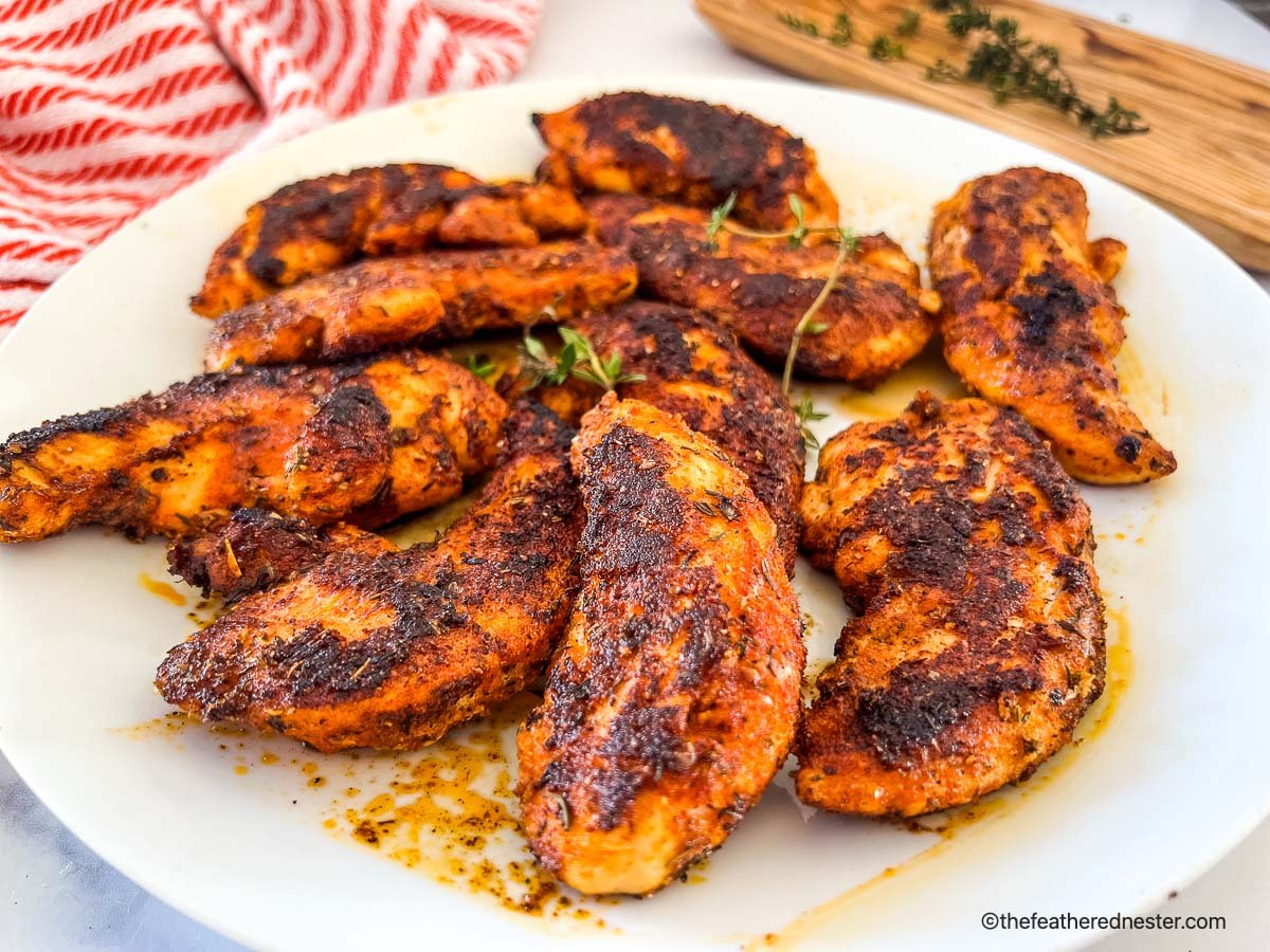 a plate of blackened chicken strips.