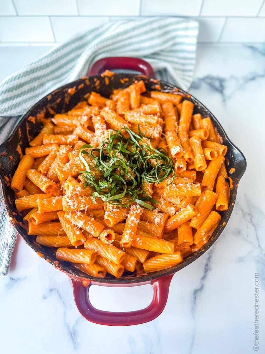 spicy vodka sauce with rigatoni in a casserole dish.