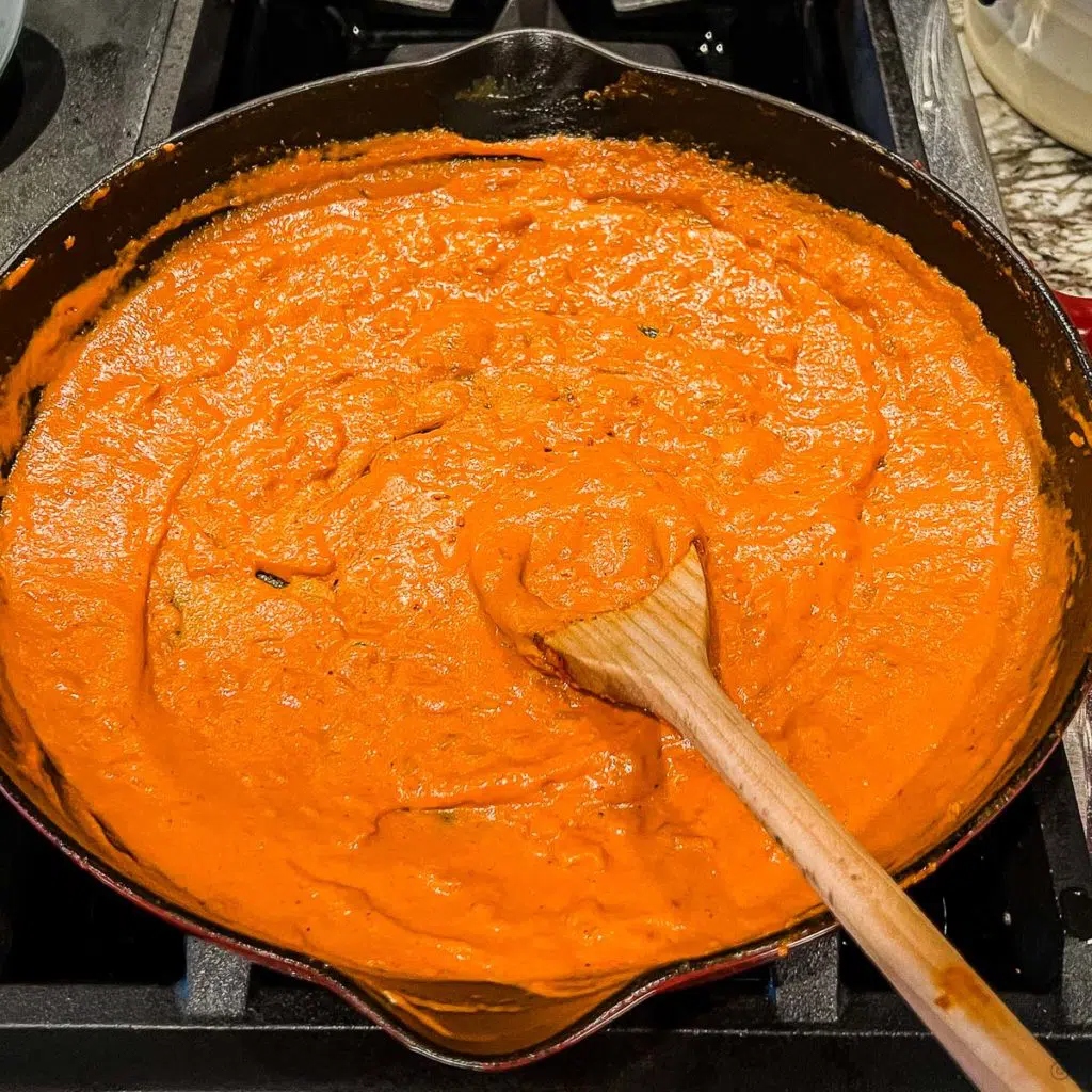 a skillet with a creamy spicy vodka sauce