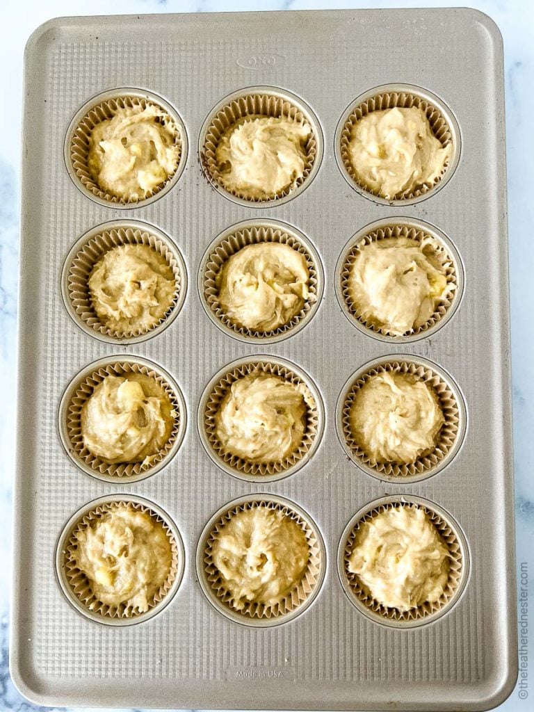 a muffin pan filled with muffin batter