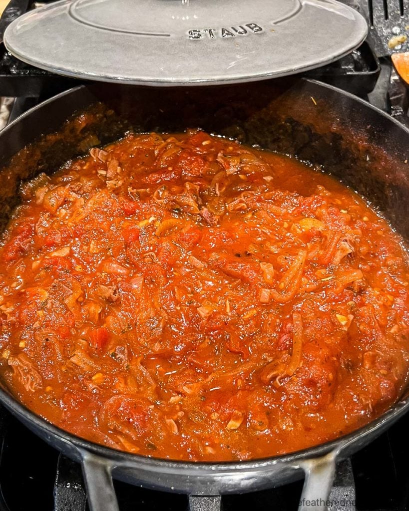 a cast iron skillet with filetto di pomodoro sauce