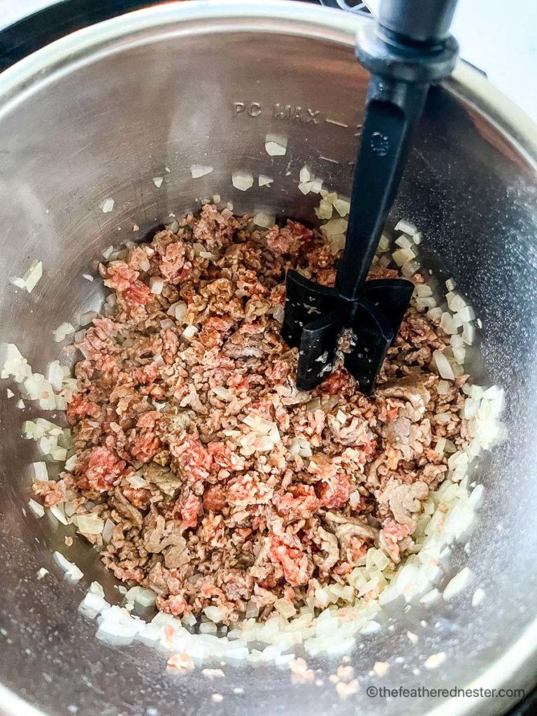 Ground chicken or pork Italian sausage browning in the Instant Pot.