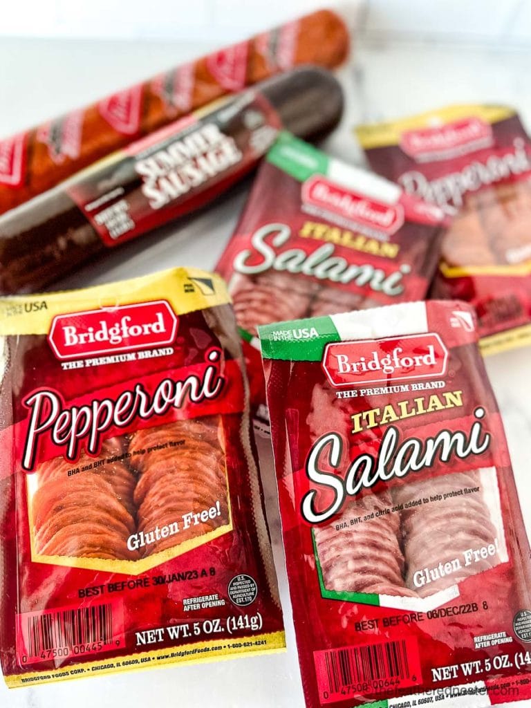 packages of Bridgford salami, pepperoni, a roll of summer sausage and pepperoni