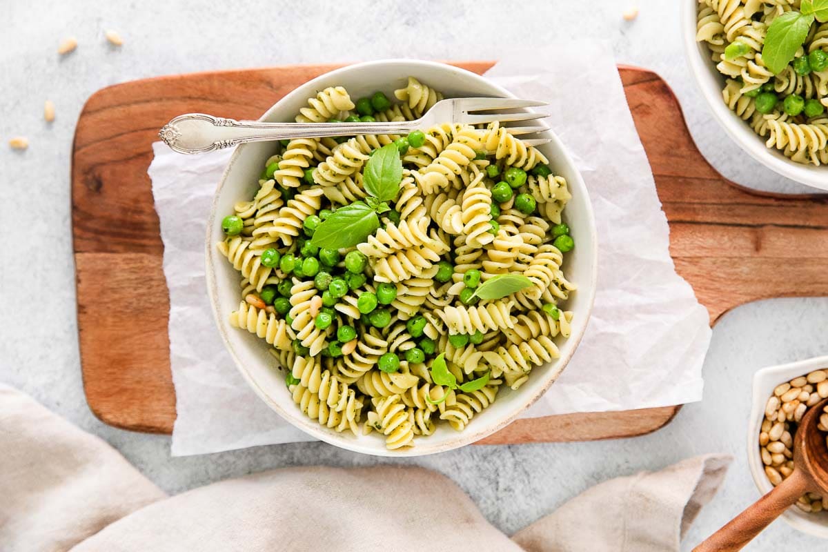 A bowl of pasta with peas