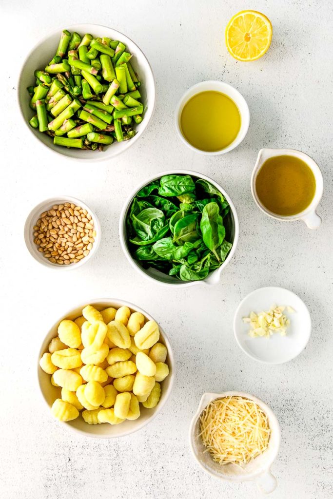 Ingredients for Pesto Gnocchi with Asparagus Recipe, contains of Asparagus, Gnocchi, Olive oil, Juiced Lemon, Basil, Toasted Pine nuts, Garlic, and Parmesan cheese