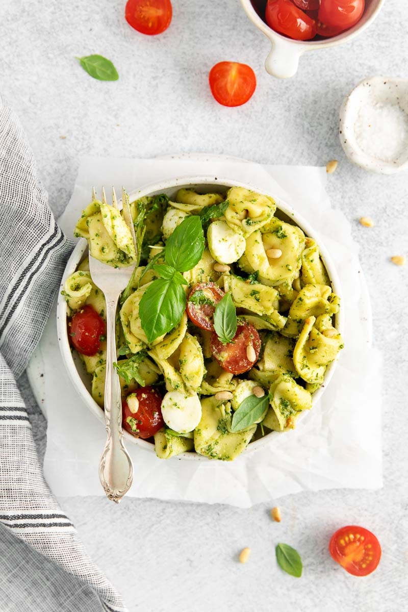 Tortellini Pasta Salad in a bowl with a fork laying over the top.