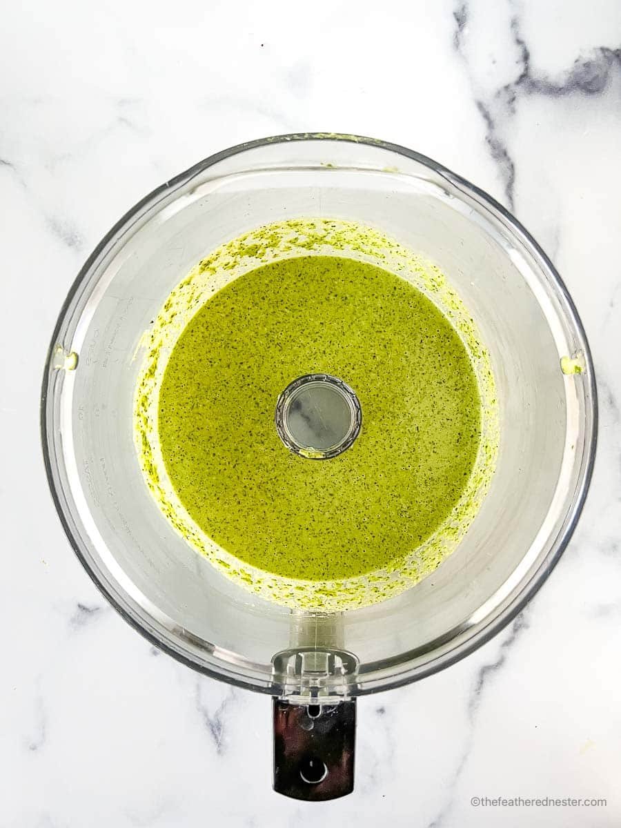 Pulsing all the vinaigrette ingredients in a food processor.
