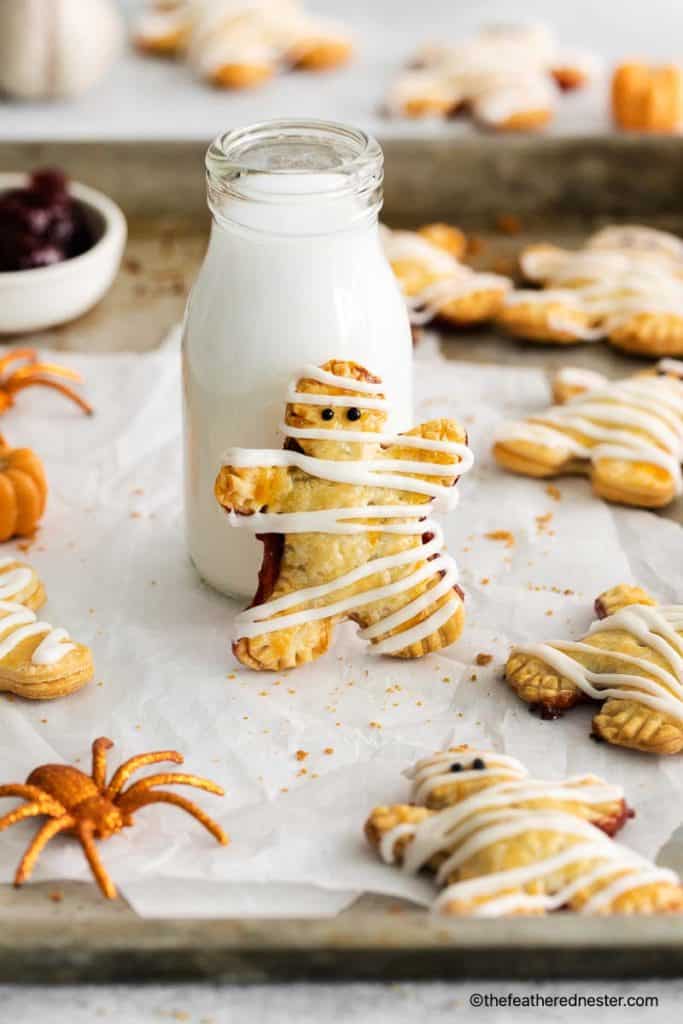 These mummy hand pies are the perfect way to celebrate Halloween! They're easy to make and filled with delicious berry filling. Plus, they're made with cute pie crust cut outs that will definitely get you in the Halloween spirit.