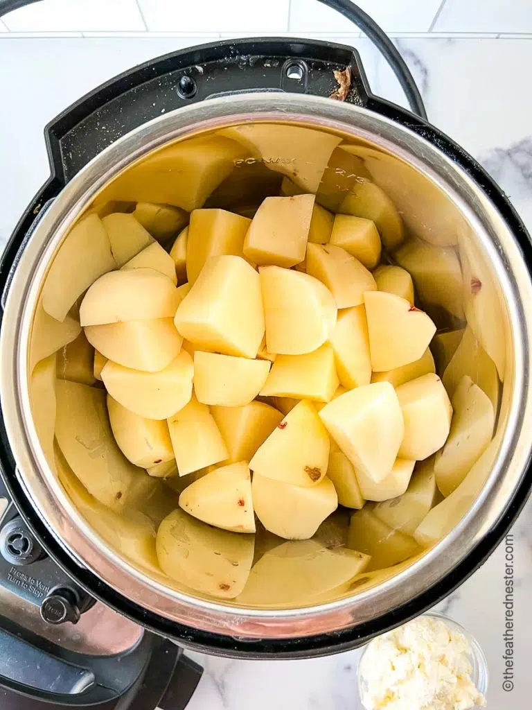 cut red potatoes in the Instant Pot ready to pressure cook