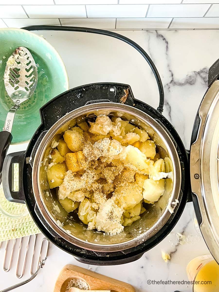 Mashing red potatoes in an Instant Pot.