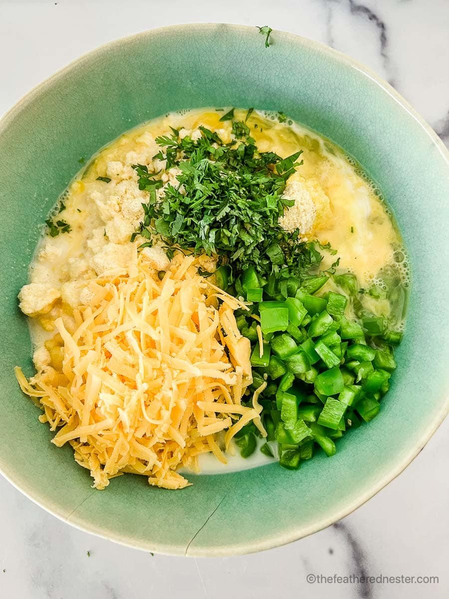 all the jalapeno cornbread ingredients inside a medium bowl.