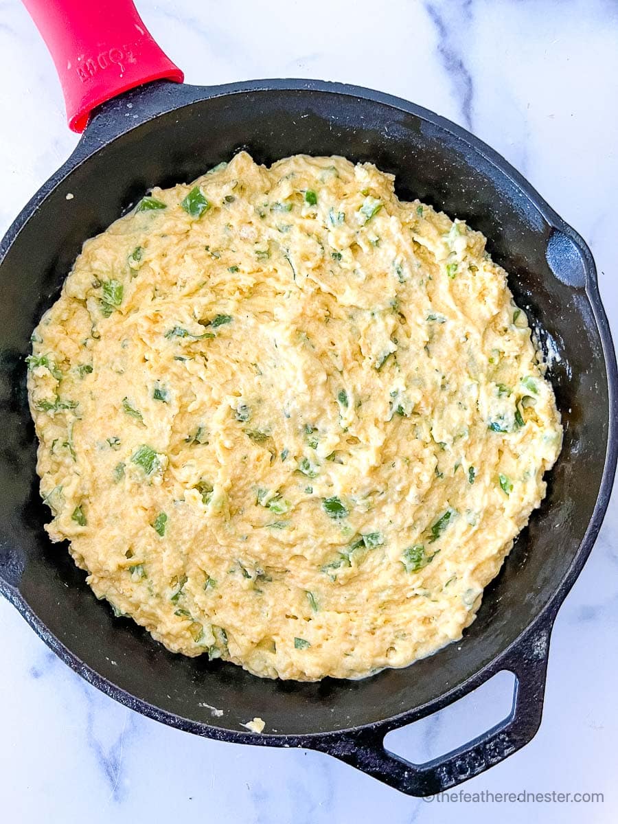 jalapeno cornbread batter on a cast iron skillet.