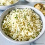 a white bowl of Instant Pot Rice ready to serve