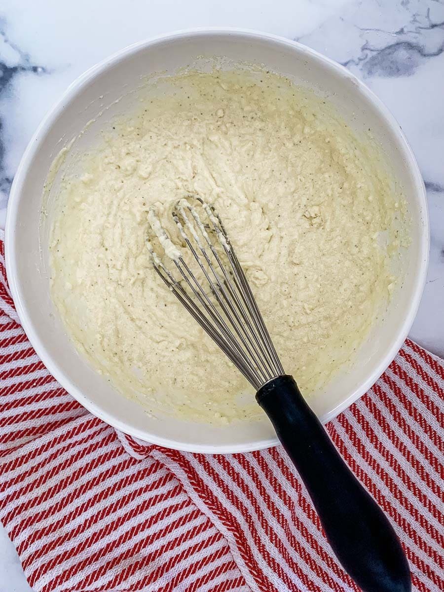 mixing all the cornbread ingredients inside a large mixing bowl. 