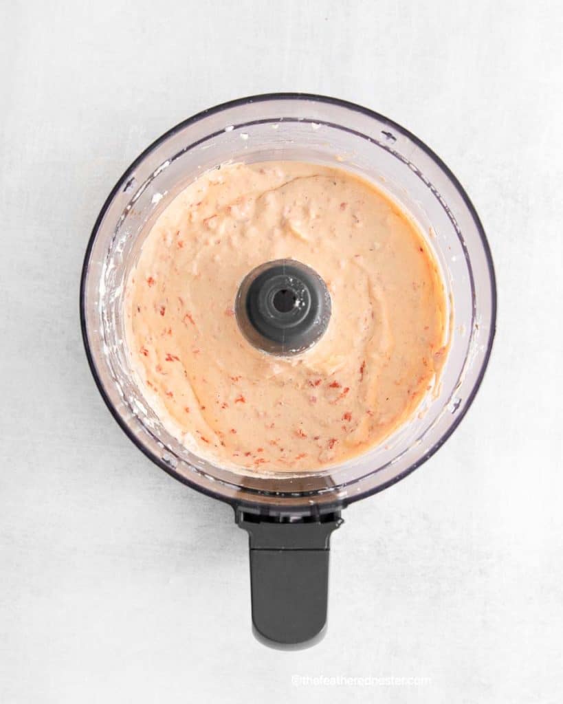 processed roasted red pepper feta dip on a food processor