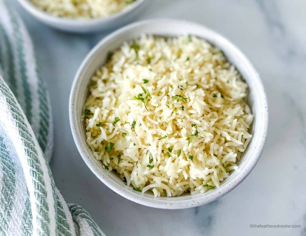 a white bowl of Coconut rice from this recipe.