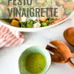 A bowl of pesto vinaigrette with a bowl of salad.
