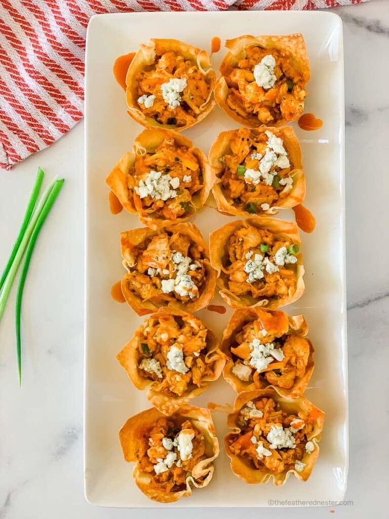 a white serving tray with buffalo chicken bombs.