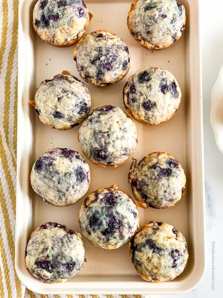 baked Bisquick blueberry muffins in a baking sheet.