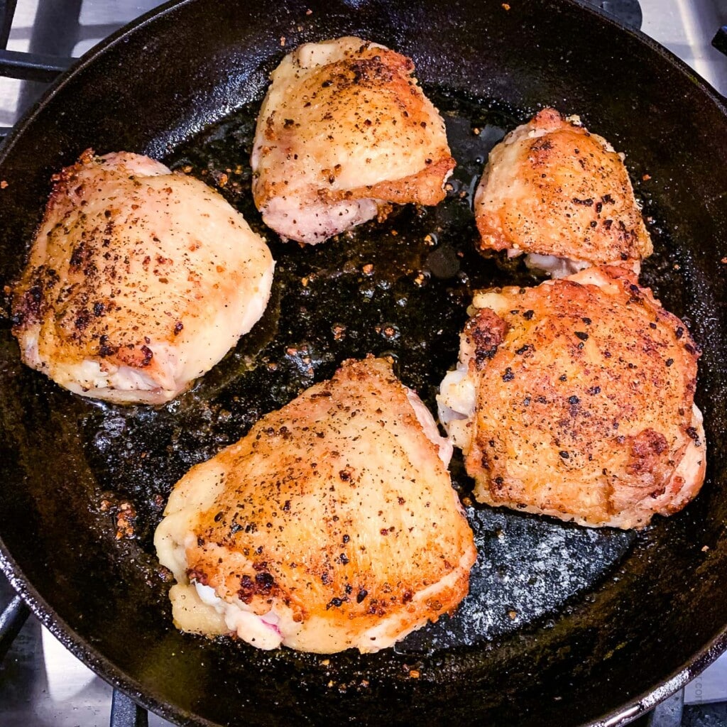 browning the chicken thighs in cast iron skillet.