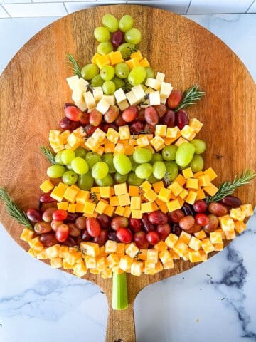 Christmas Tree Cheese Appetizer on a wooden board.