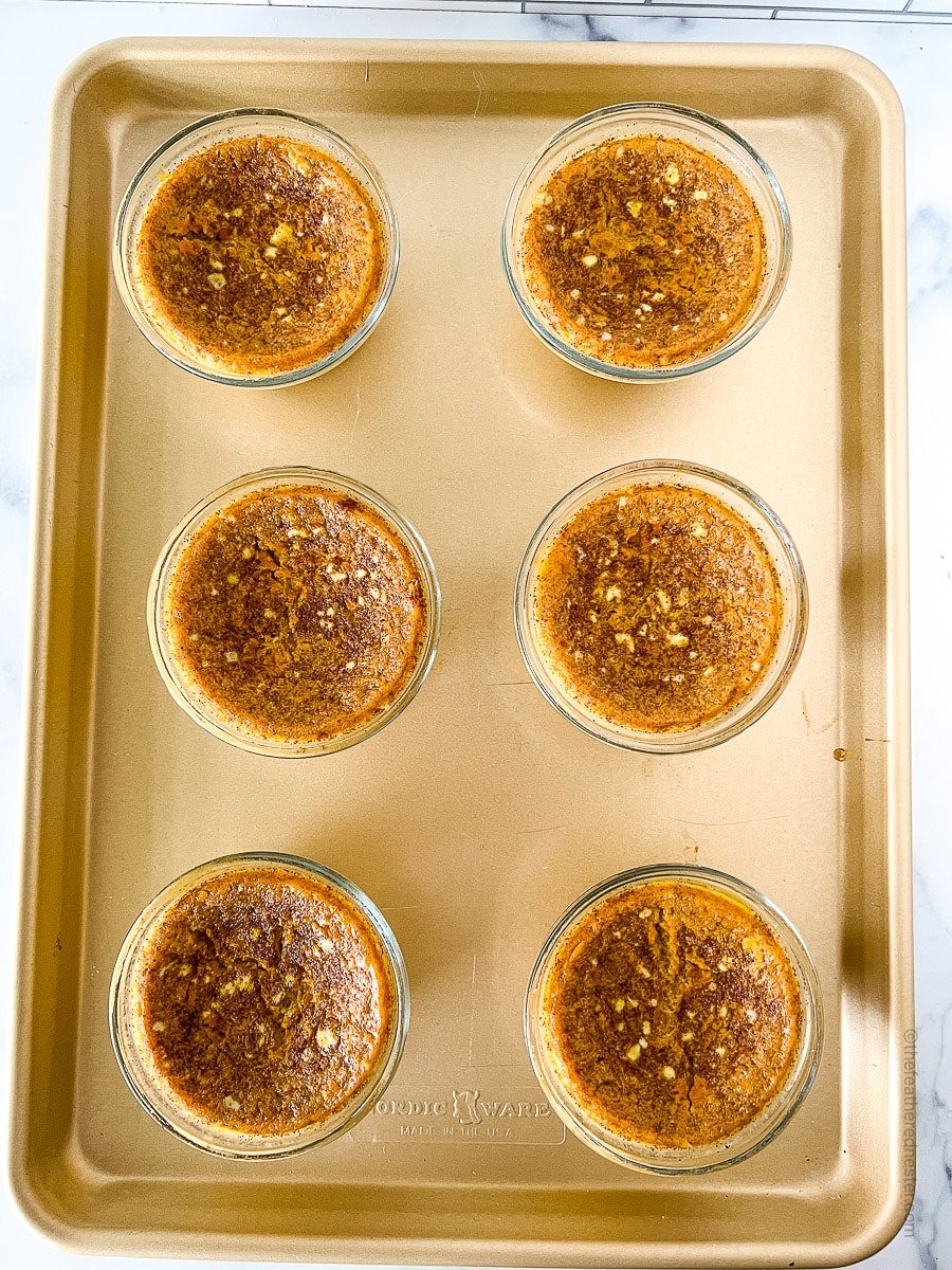 baked pumpkin custard on a baking sheet.