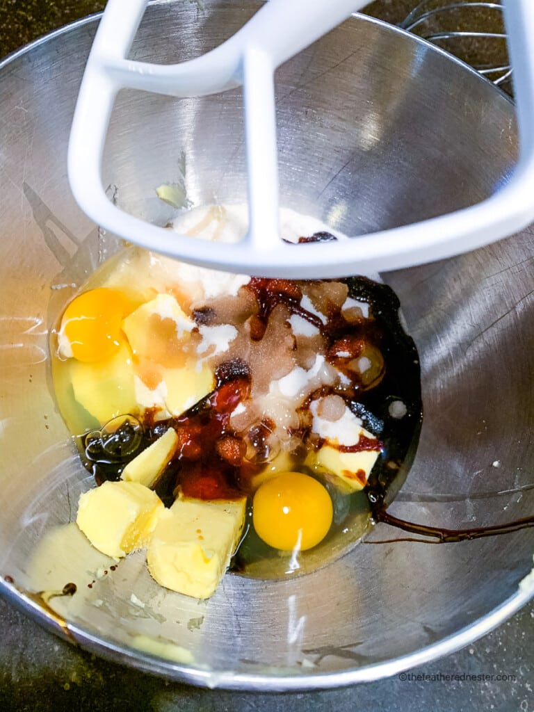 wet ingredients placed in a stand mixer bowl.