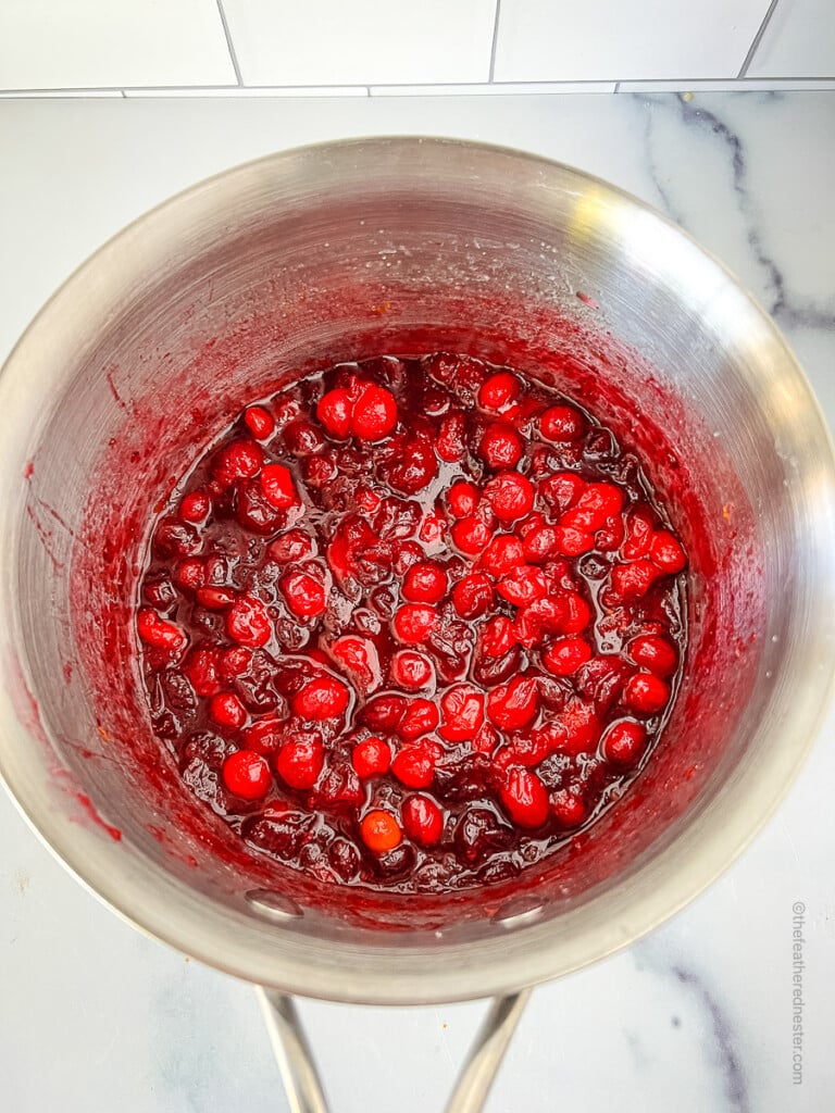 the cooked cranberry sauce in the saucepan