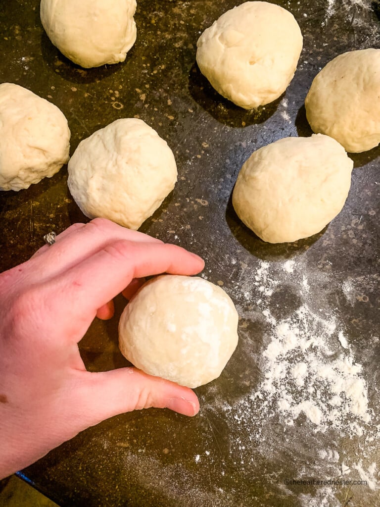 rolling the dough into balls using by hand.