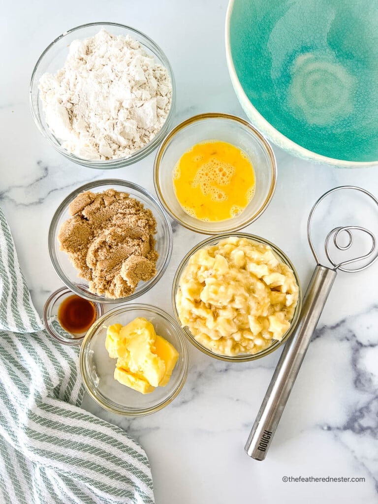 ingredients for making Bisquick Banana Bread which consists of unsalted butter, brown sugar, Bisquick mix, beaten egg, mashed ripe bananas, and vanilla extract.