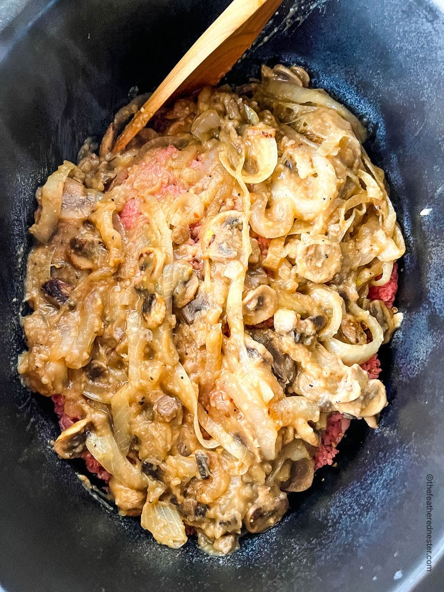 Mushroom and onion gravy over cube steak in Crock Pot.