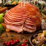 festive looking photo of sliced Crock Pot Dr Pepper Ham on a wooden board with a festive design in the background. with writings