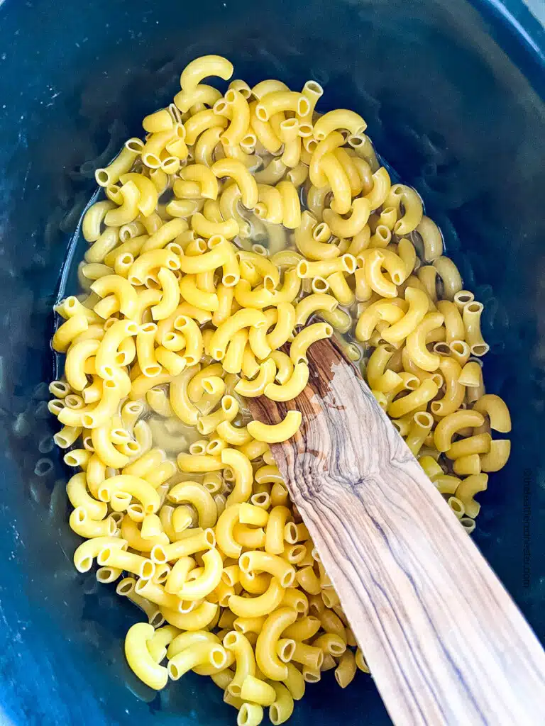hot water and elbow macaroni in a slow cooker