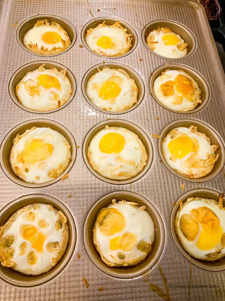 Baked hash brown breakfast cups in a muffin pan.